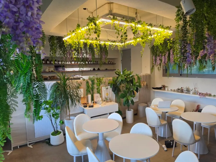 Café interior decorated with bright flowers