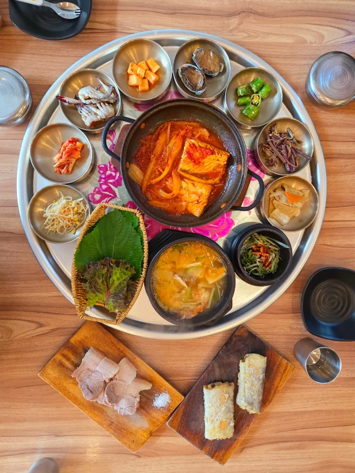 Round tray filled with 13 side dishes