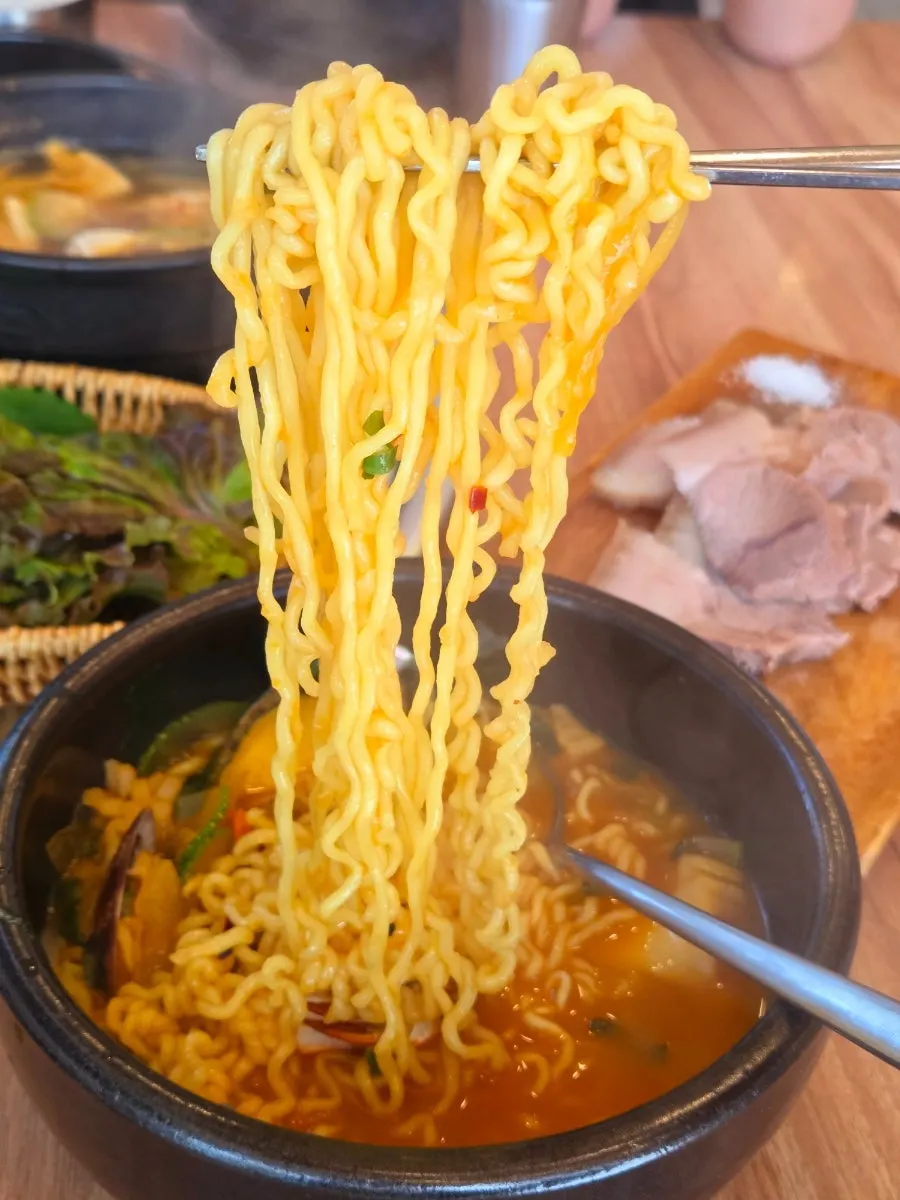 Broth of the seafood ramyeon loaded with seafood