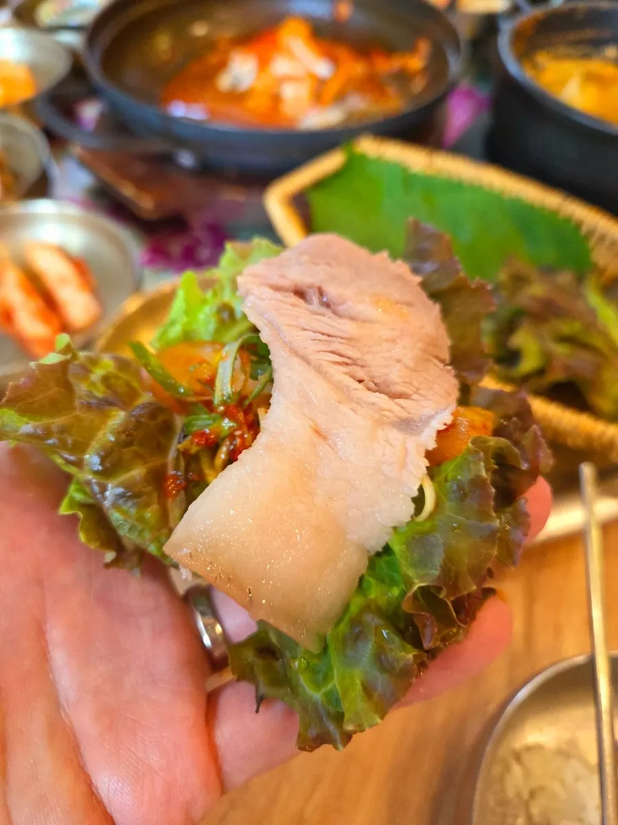Dombegogi wrapped with side dishes