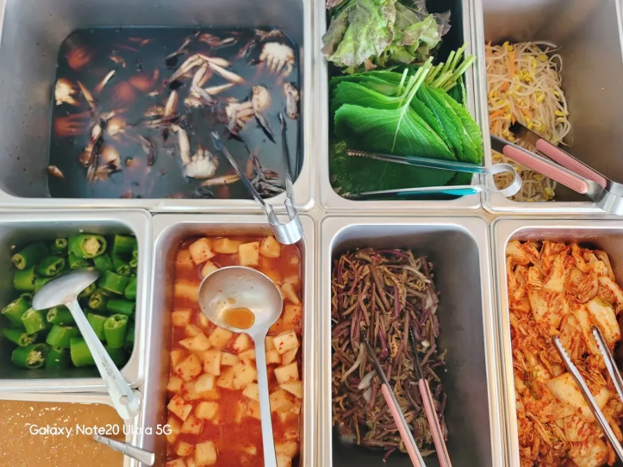 Self-serve bar with lettuce wraps and side dishes