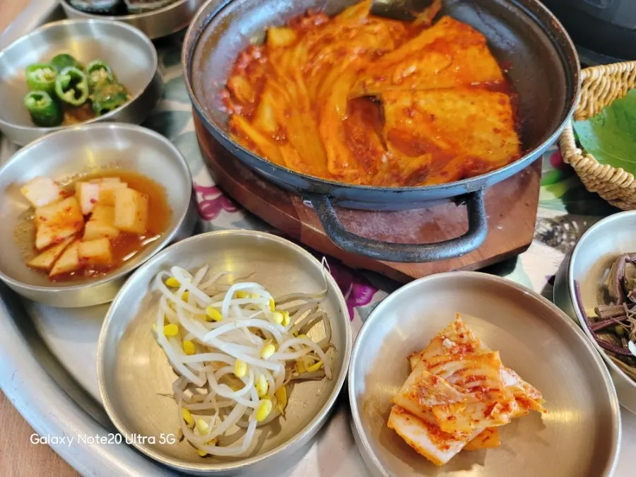 Table filled with side dish plates