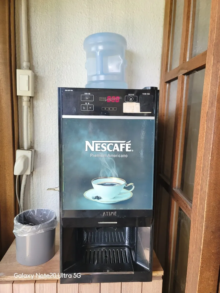 Cup of vending machine coffee after the meal