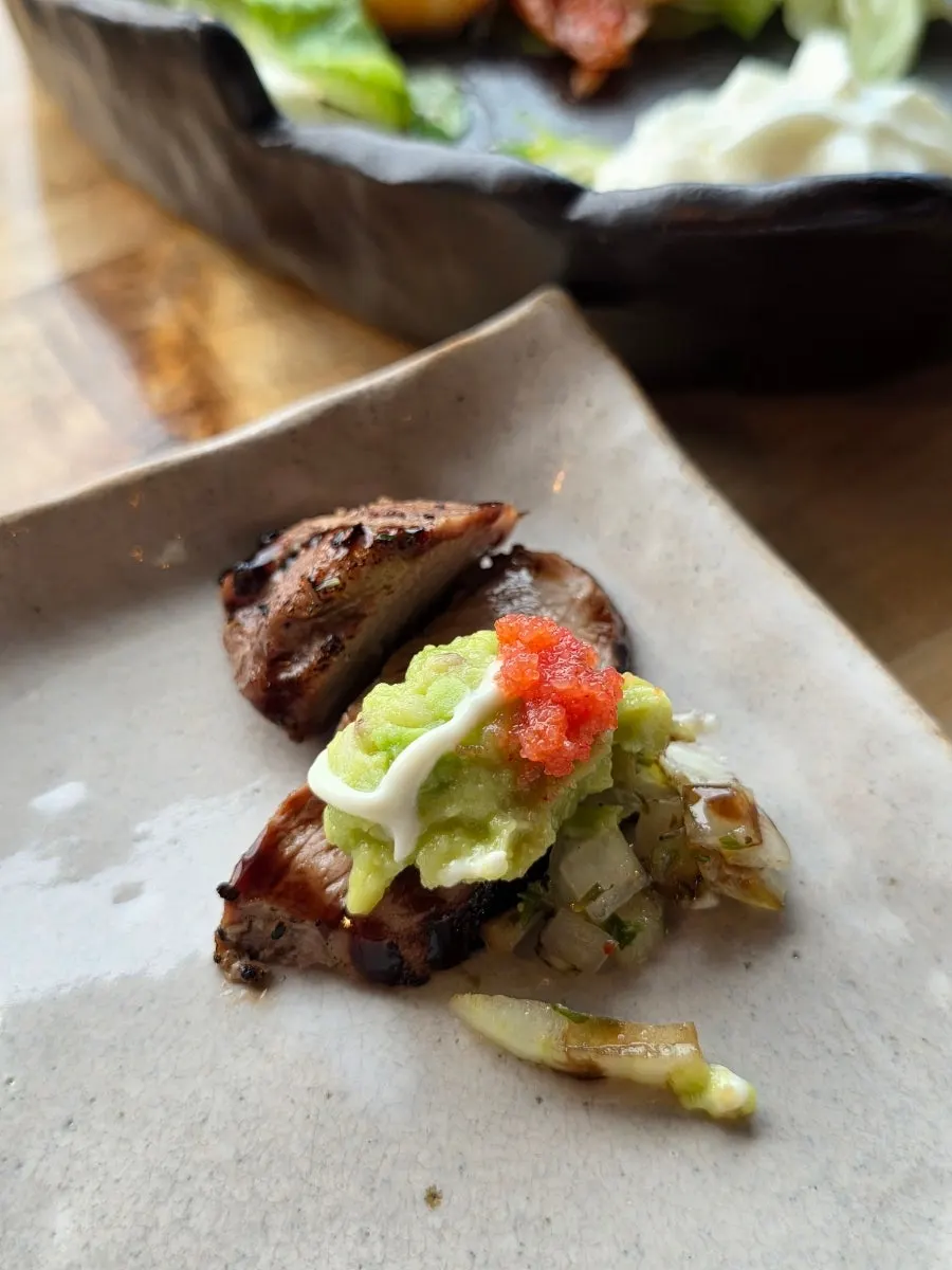 Steak served with guacamole
