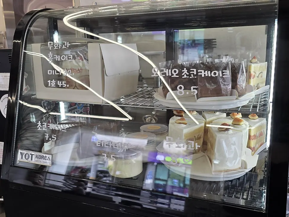Slices of cake arranged in the display case