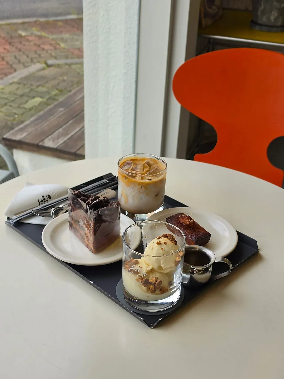 A table spread with drinks and desserts