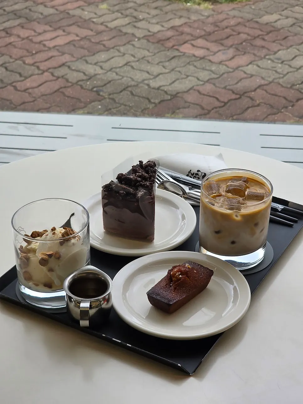 Gluttony latte with a dessert plate