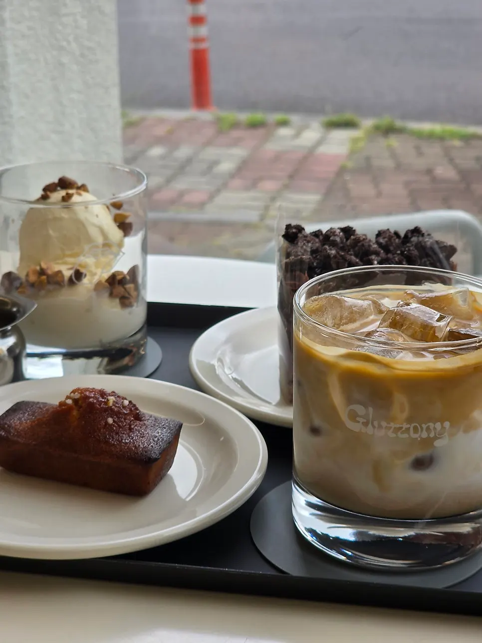 A cup of the nutty-milk-flavored Gluttony latte