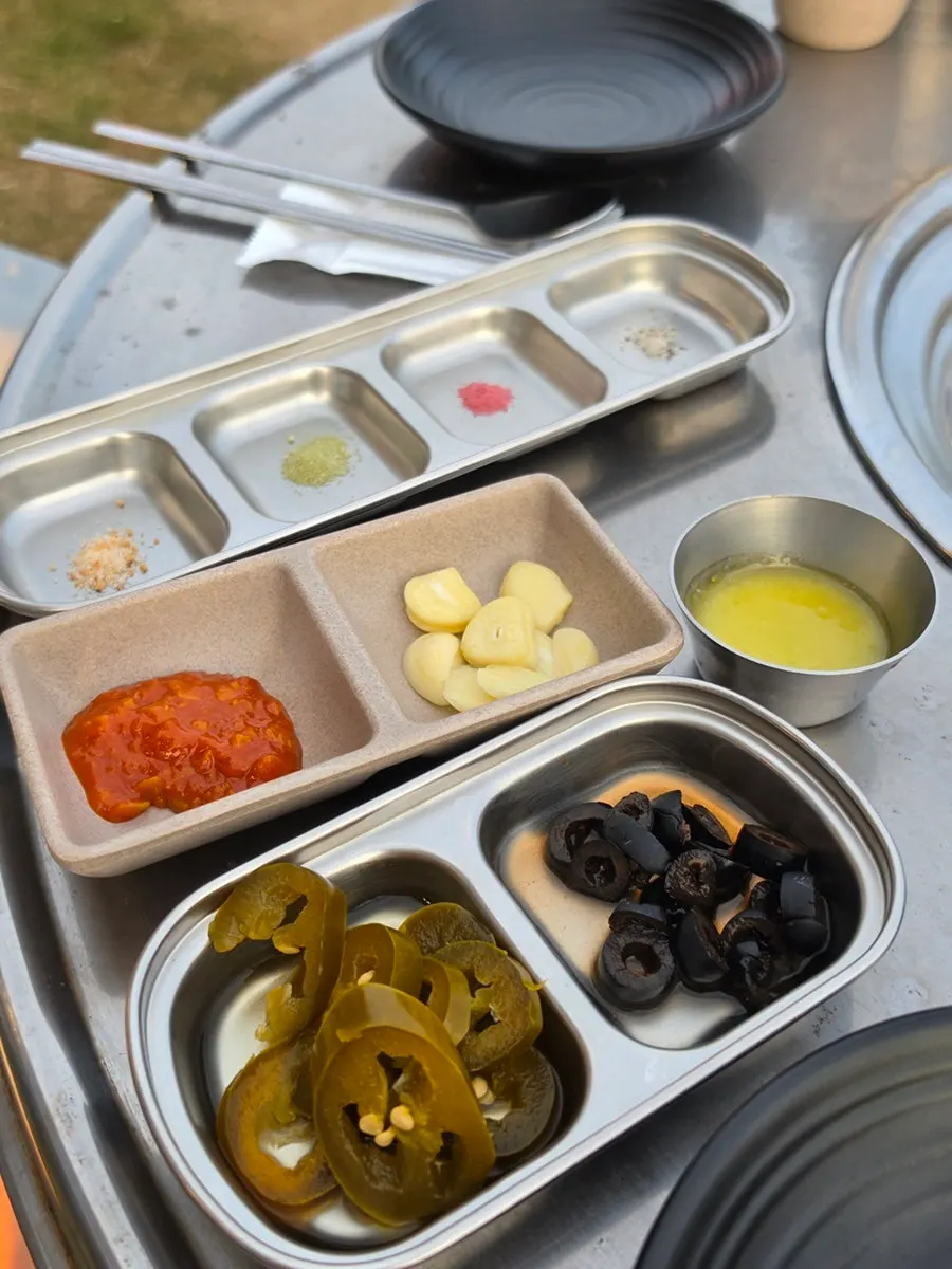 A plate of olives and jalapeños