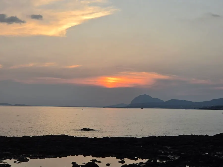 Sunset seen from the outdoor tables at Jeju Healing Dwaeji