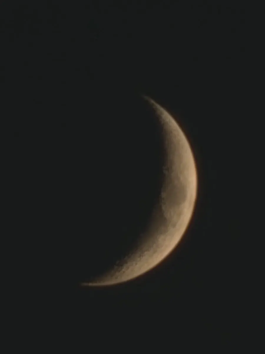Crescent moon in the sky after sunset