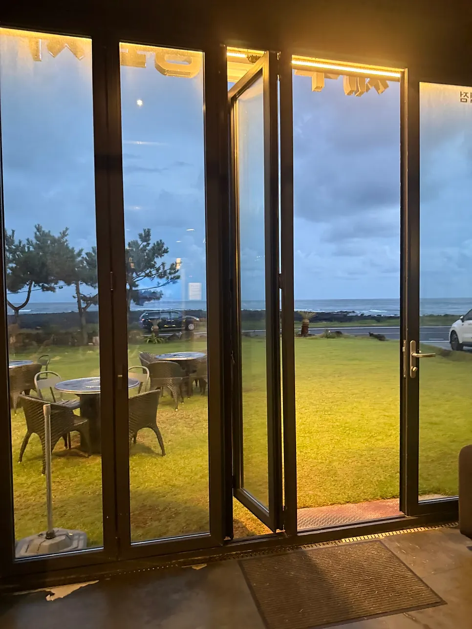 Grassy yard and outdoor tables at sunset