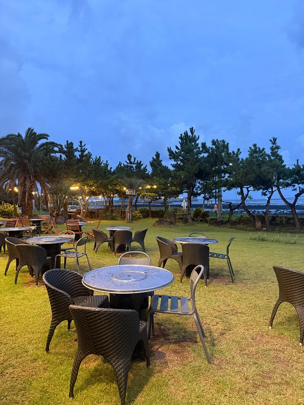 Exterior of the restaurant under a sunset sky