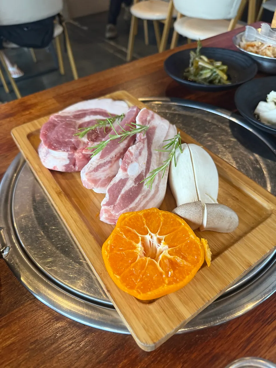 Half a tangerine served alongside the meat