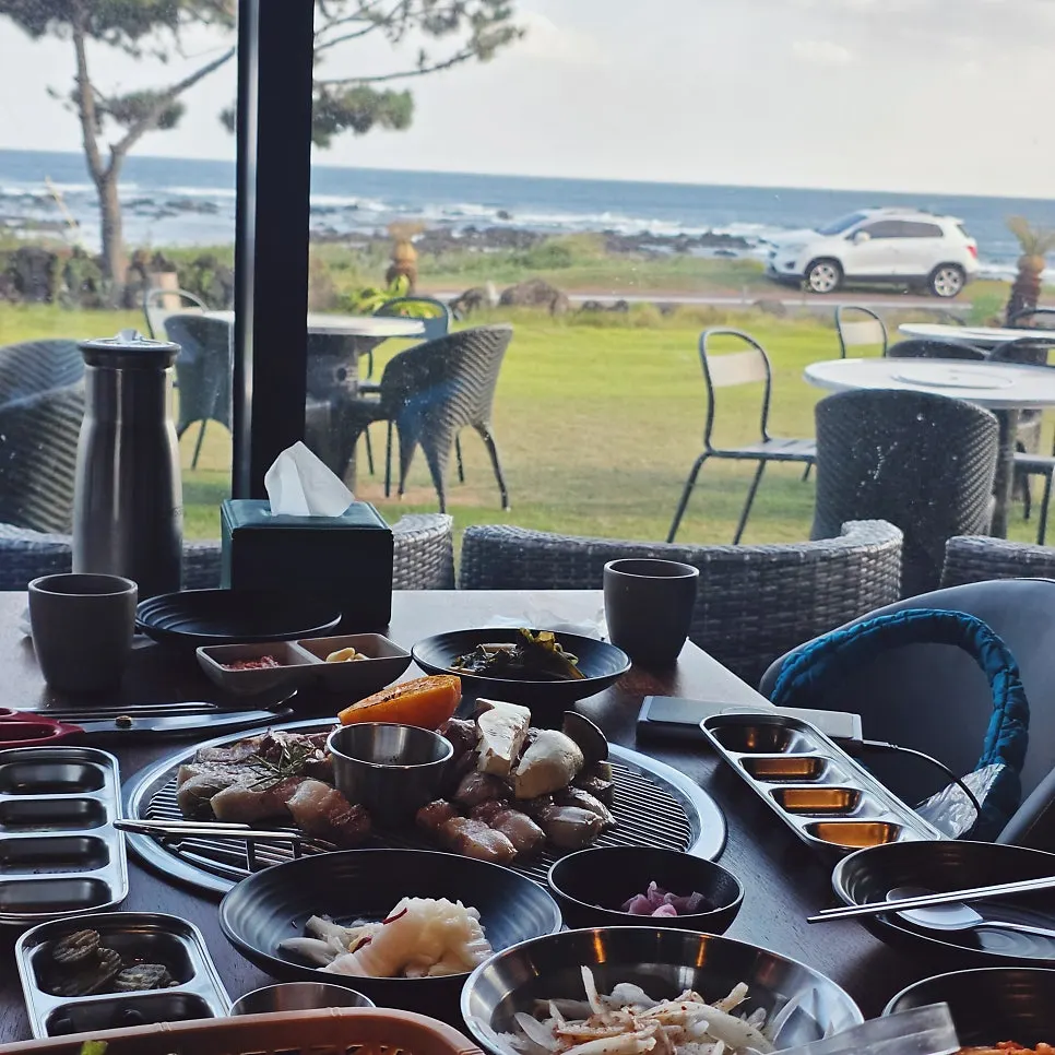 Jeju black pork enjoyed with an ocean view