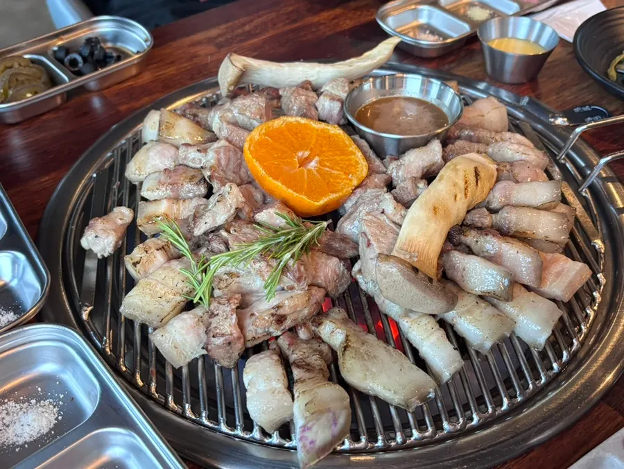 Full spread of the grilled black pork table setting