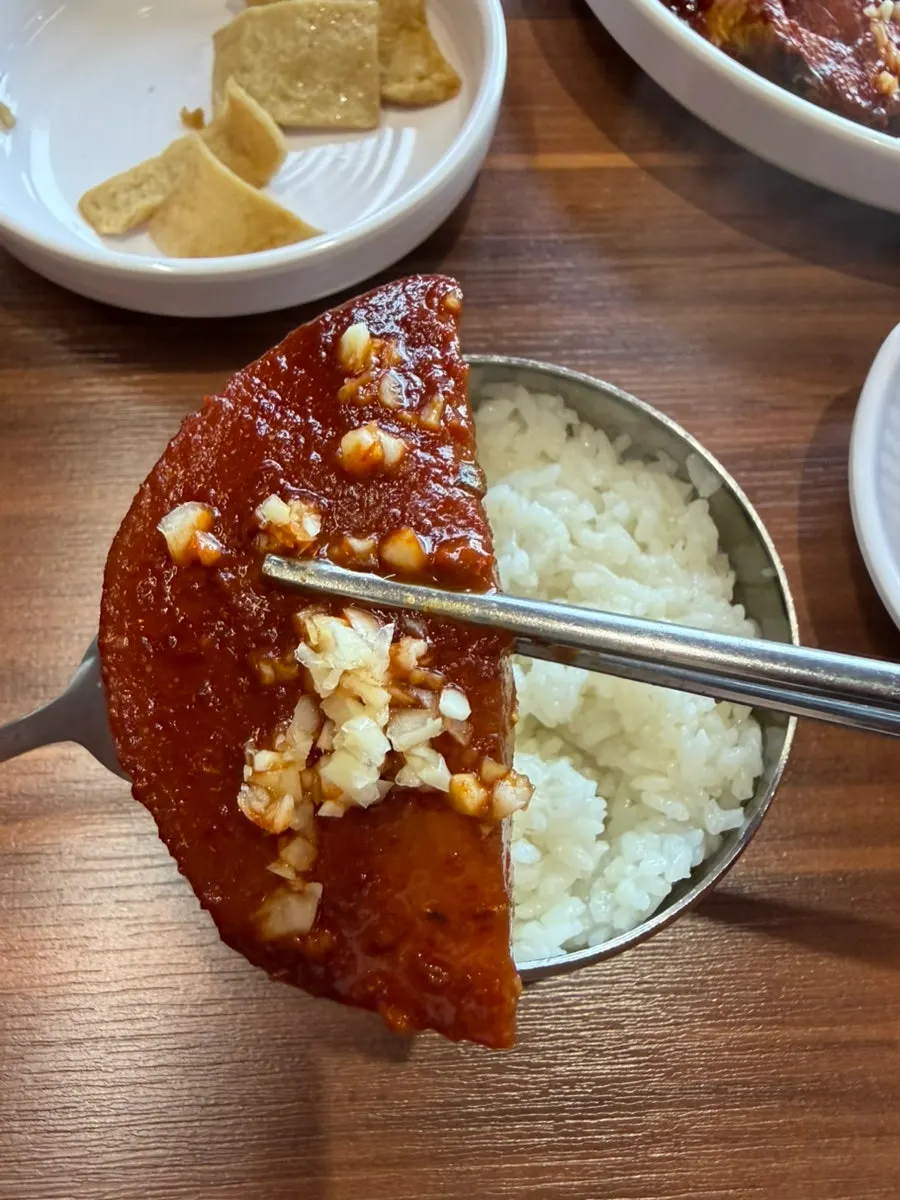 Mackerel stew served with sauce and radish