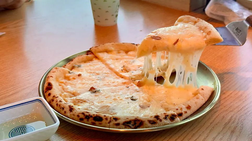 The wood-fired pizza we ordered alongside the fish