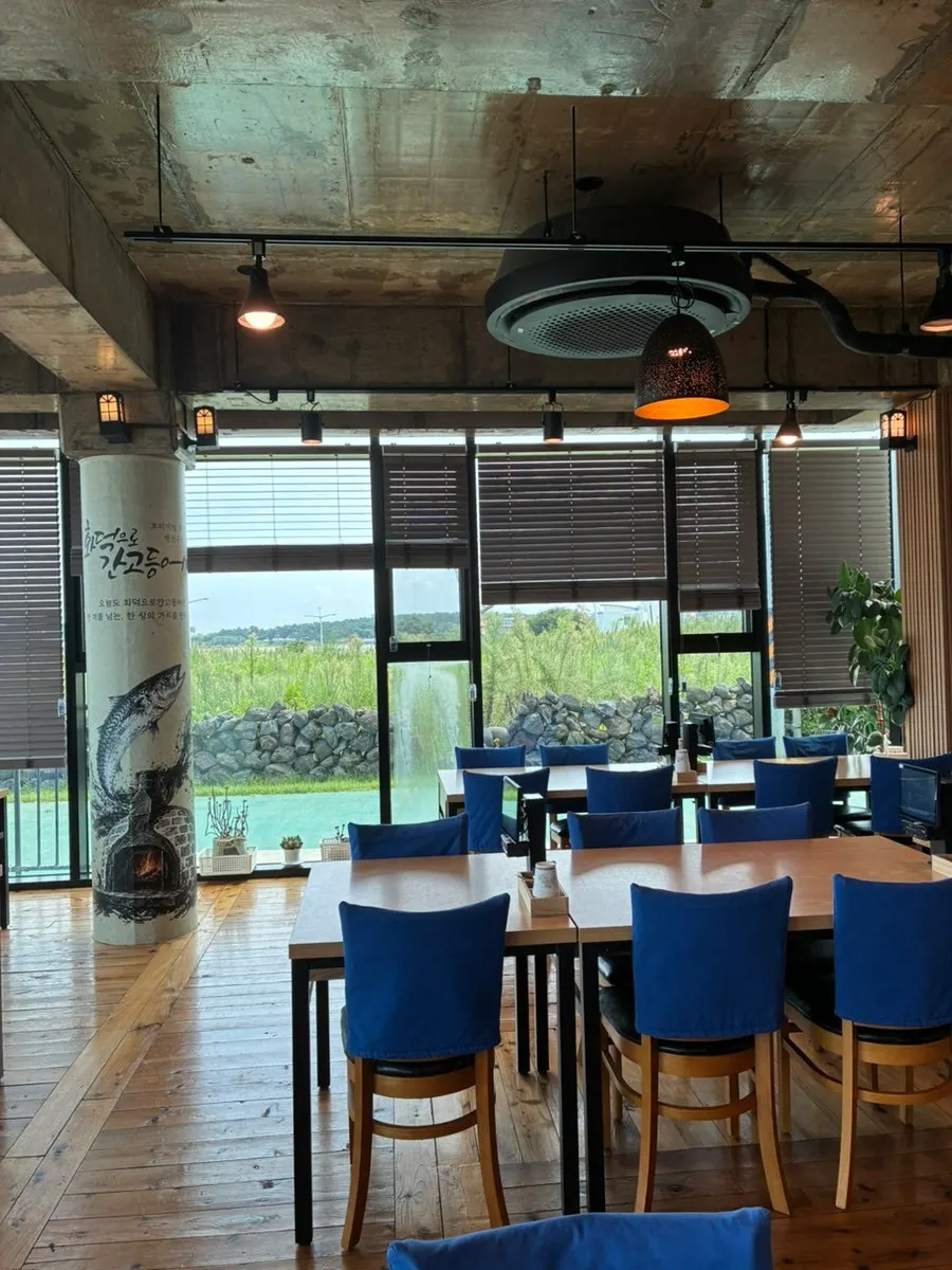 Bright interior with full-glass windows and seating