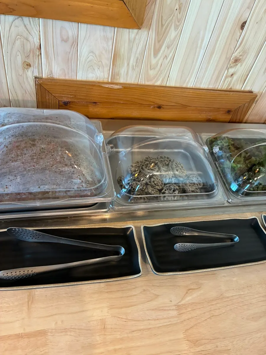 Neatly arranged side dish corner at the self-bar