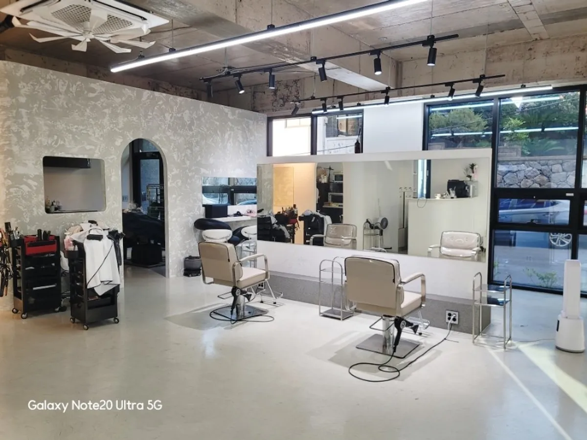 Spacious salon interior in white and gray tones