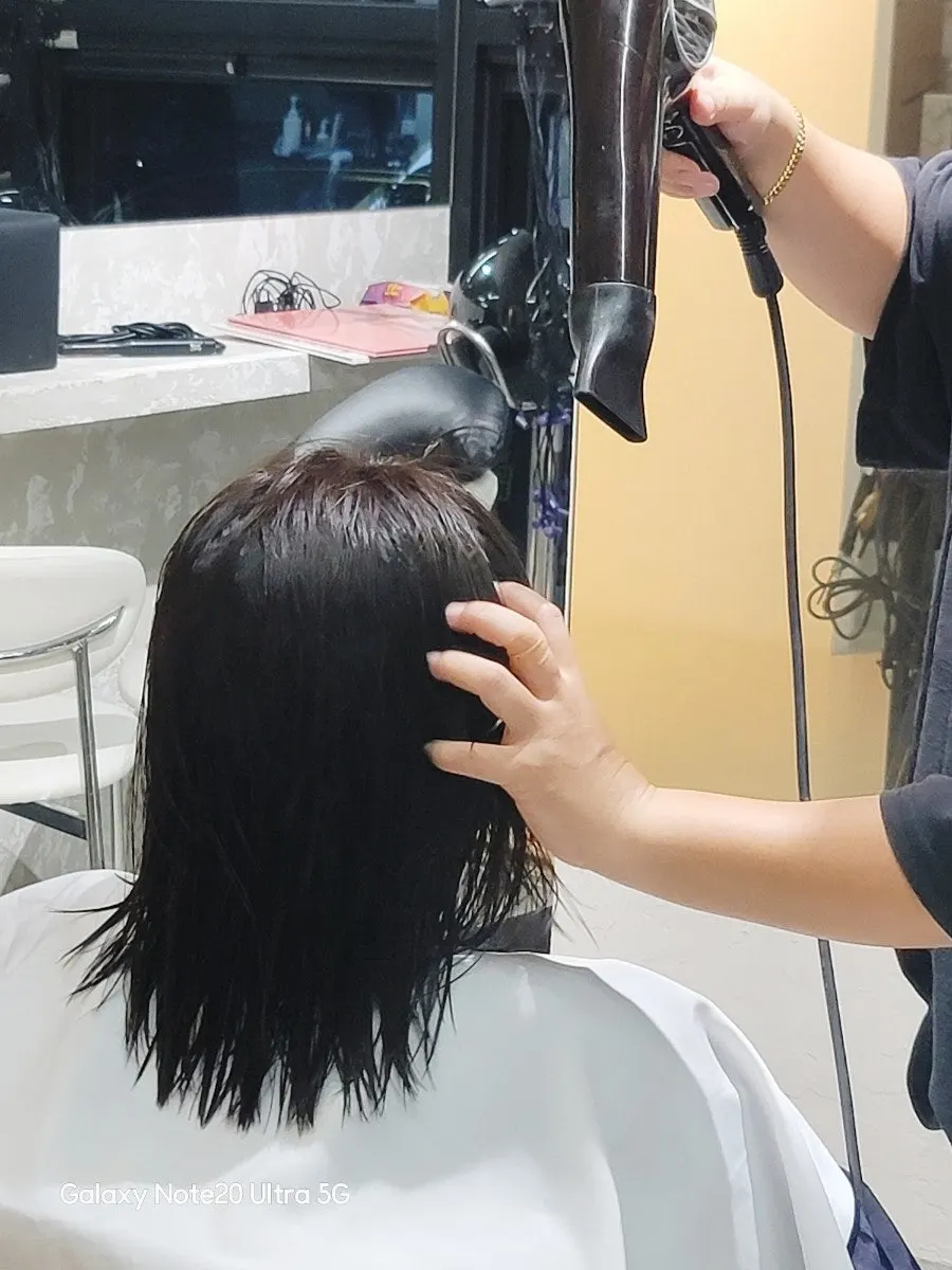 Finished slick cut with bangs down
