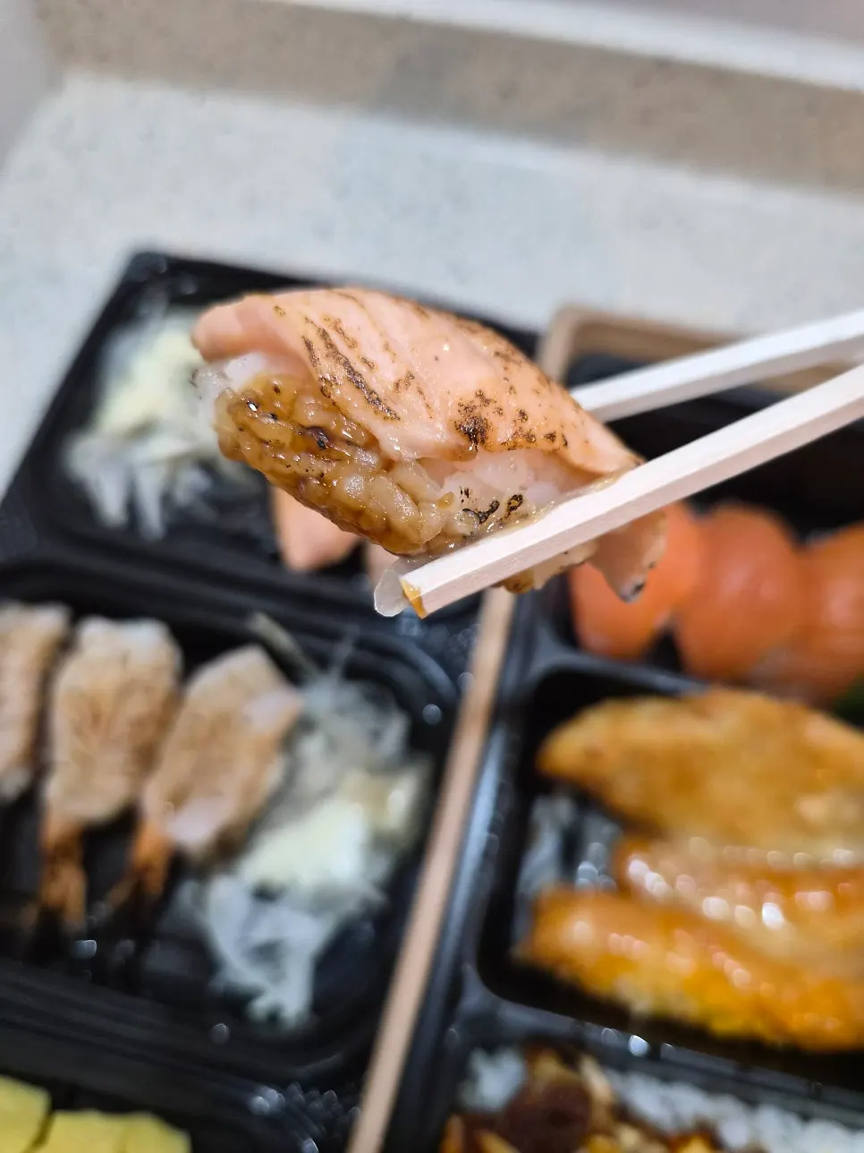 Grilled salmon sushi brushed with teriyaki sauce