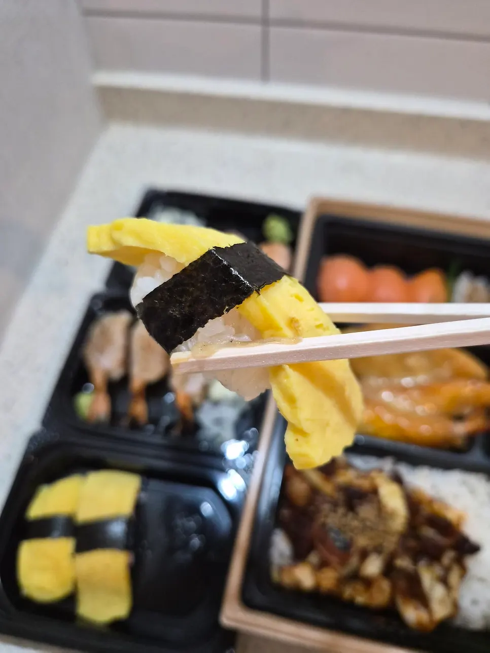 Plate of grilled shrimp sushi and egg sushi