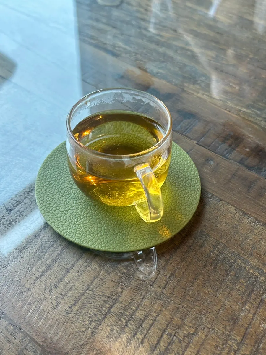 Tea enjoyed with a cup of ice and mini cups