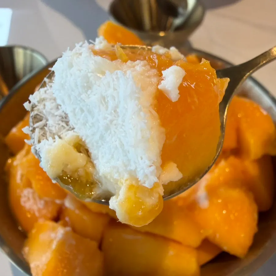 A spoonful of fresh apple mango
