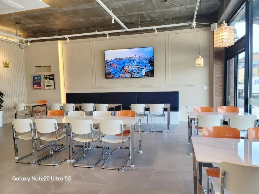 Inside Lala Cafe with exposed concrete ceiling