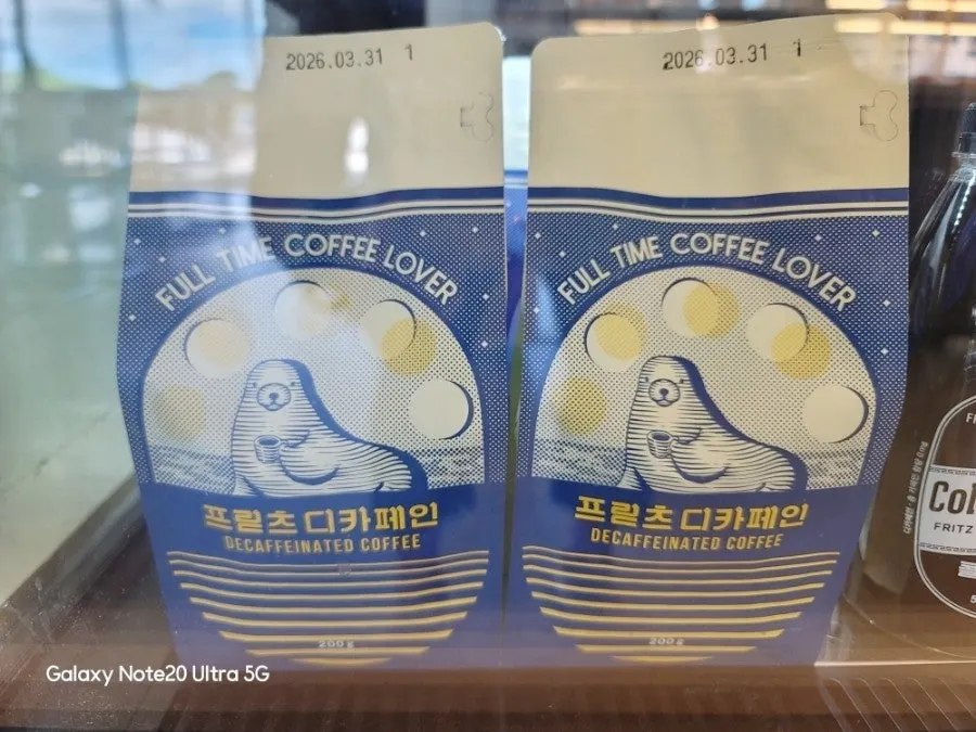 Coffee beans and drinks displayed near the counter
