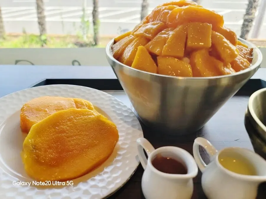 Full table spread of Lala Cafe's apple mango bingsu