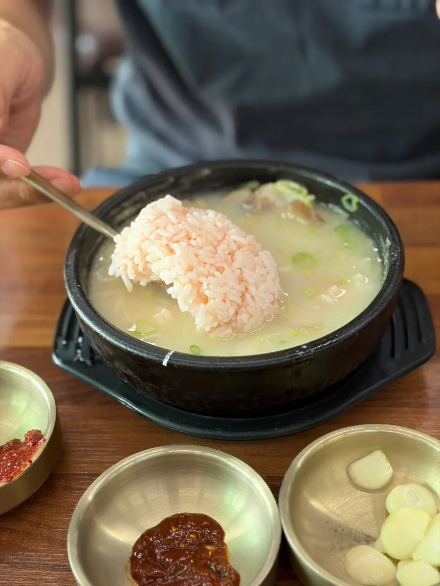 A full spread of noodles and dombegogi at Myeonjumak Jeju Main Branch