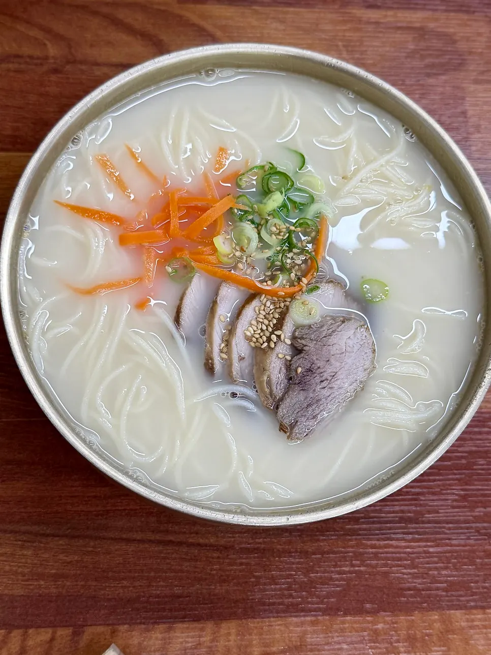Double-portion pork noodle soup topped with black pork