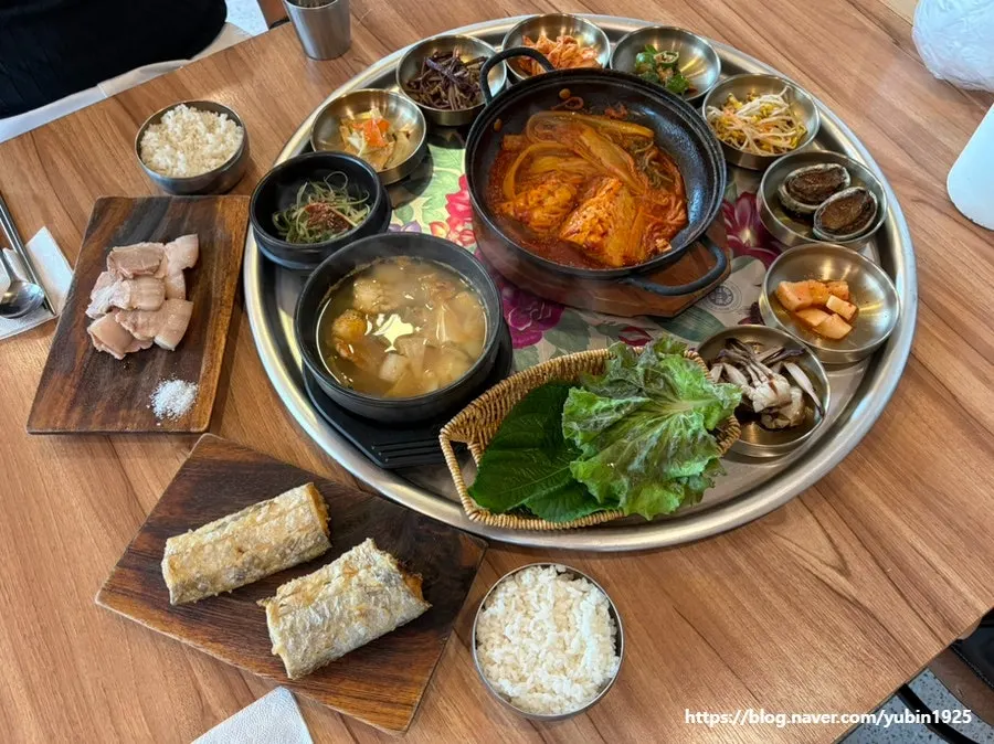 Table filled with the full Jeju set meal spread