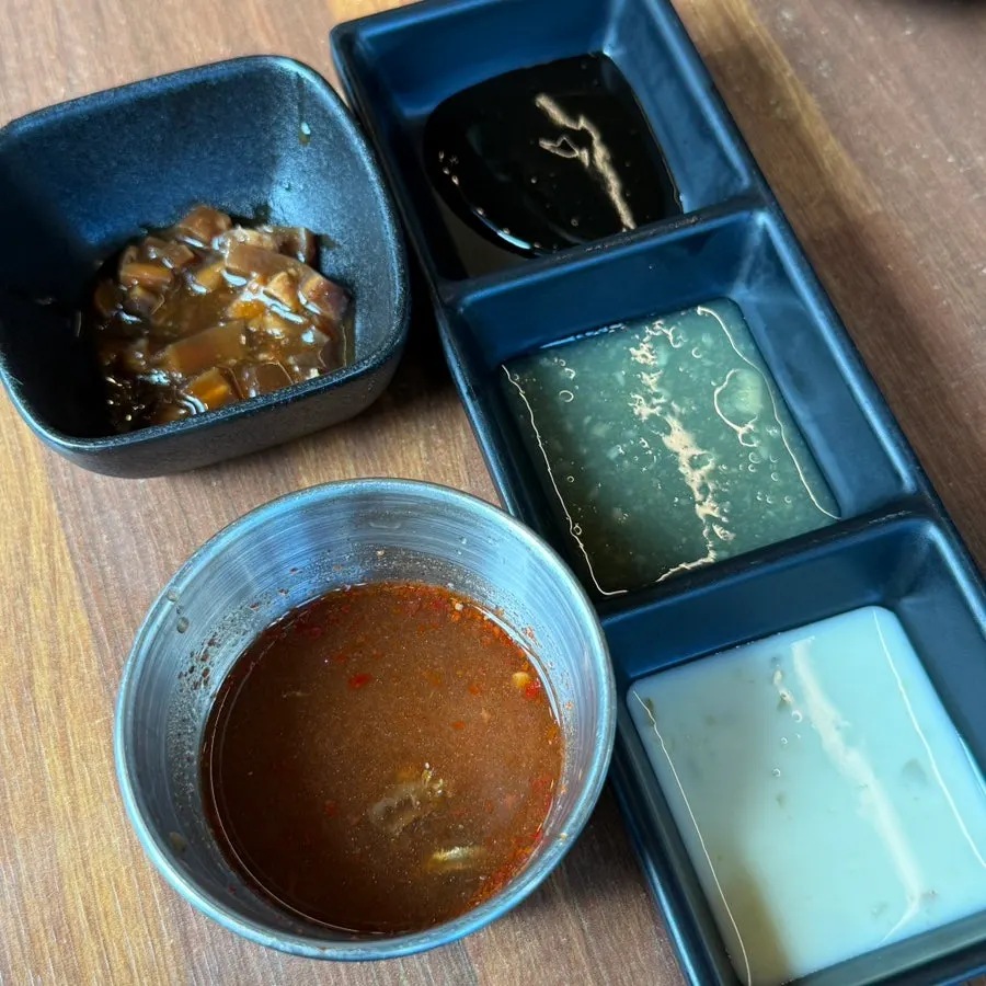 Melजeot served alongside the black pork