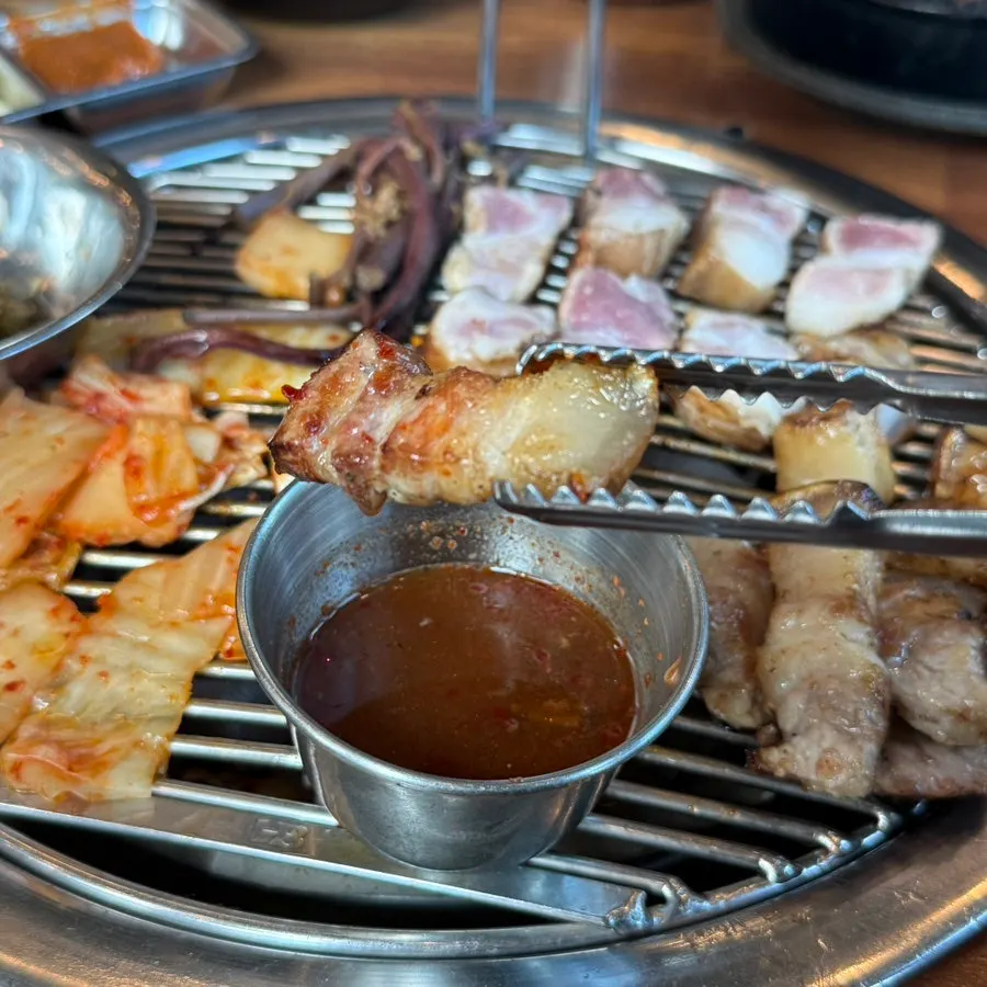 Aged black pork cooking on the grill
