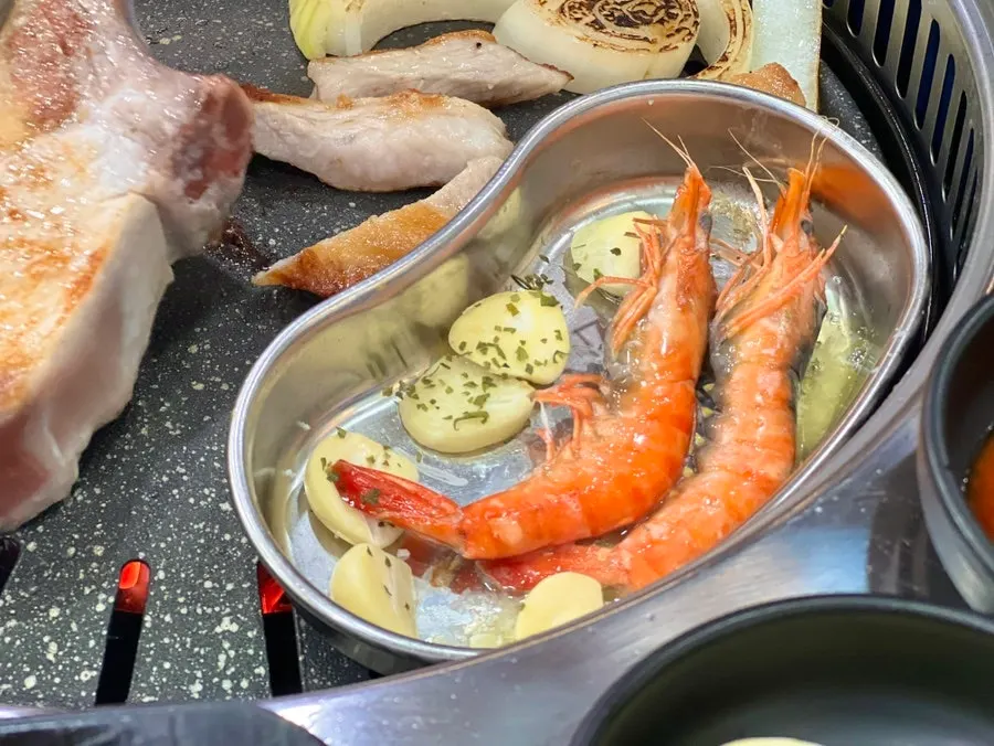 Shrimp sizzling on the grill
