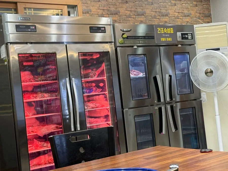Meat hanging inside the dry-aging chamber