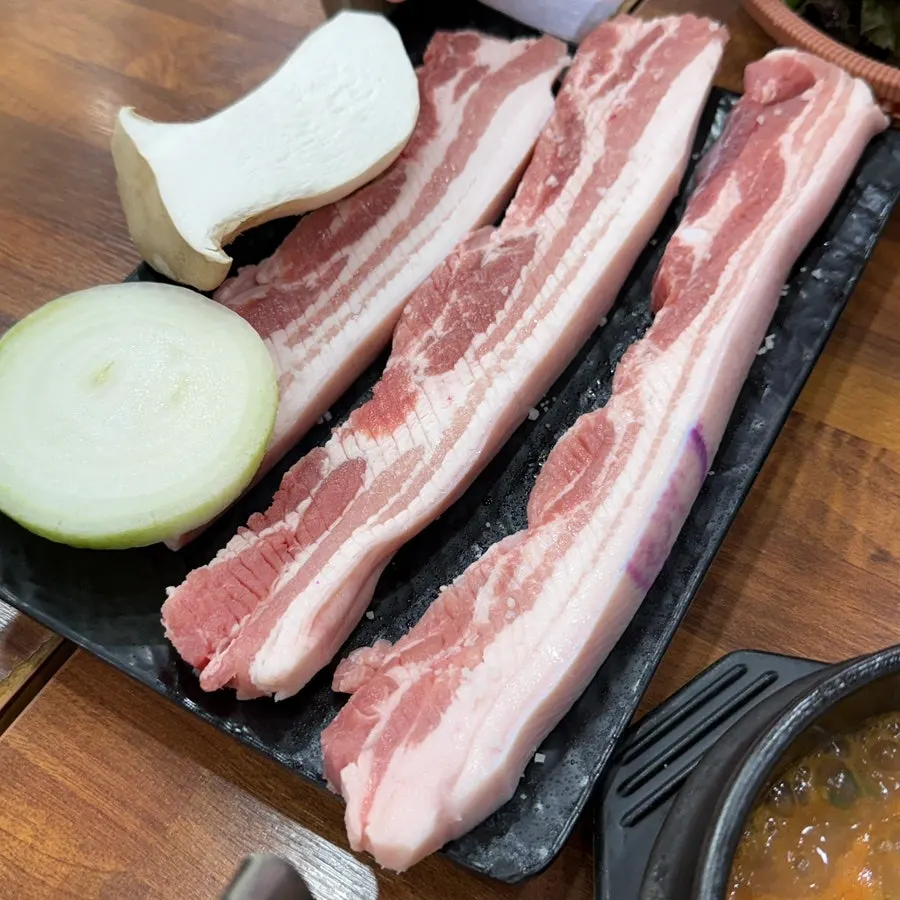 Plate of raw heukogyeop (black pork belly) ordered