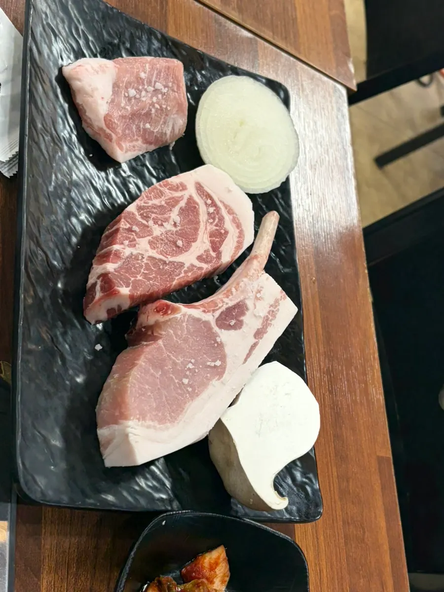 Dry-aged half portion of black bone ribeye, neck, and jowl