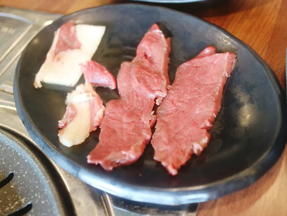 Grilled horse meat with fat and lean cuts
