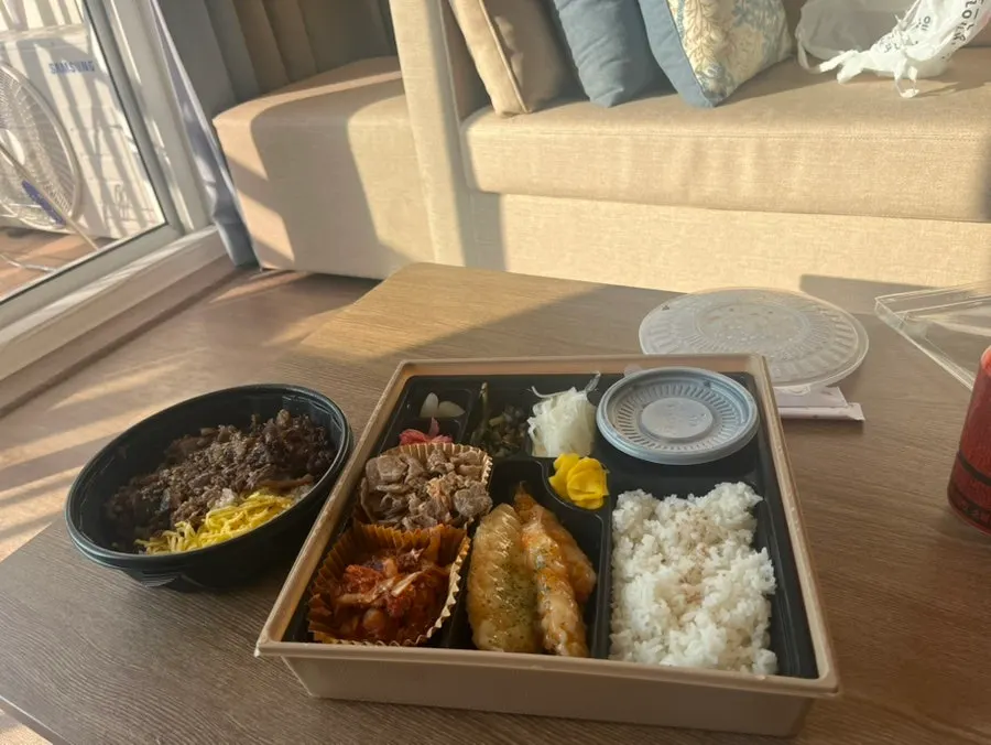 Lunch box and rice bowl meal set up at the accommodation