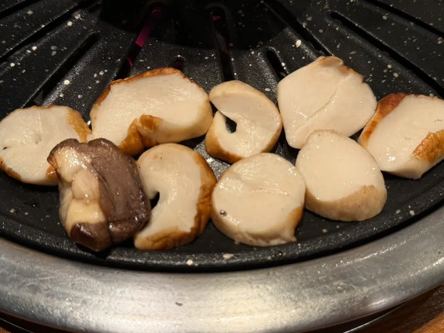 Grilled king oyster mushrooms served with the belly