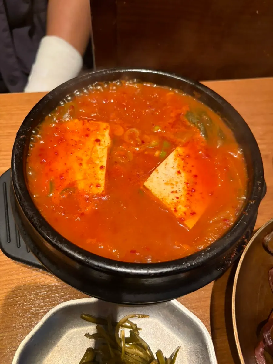 Kimchi jjigae eaten alongside the meat