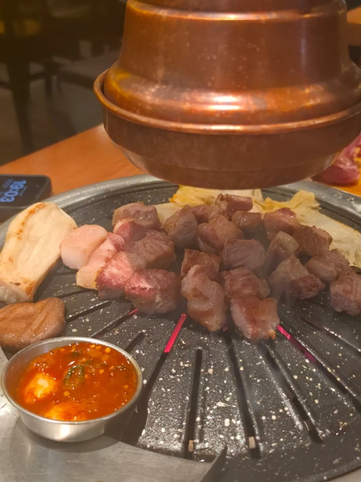 Thick cube-cut Jeju black pork neck on the grill