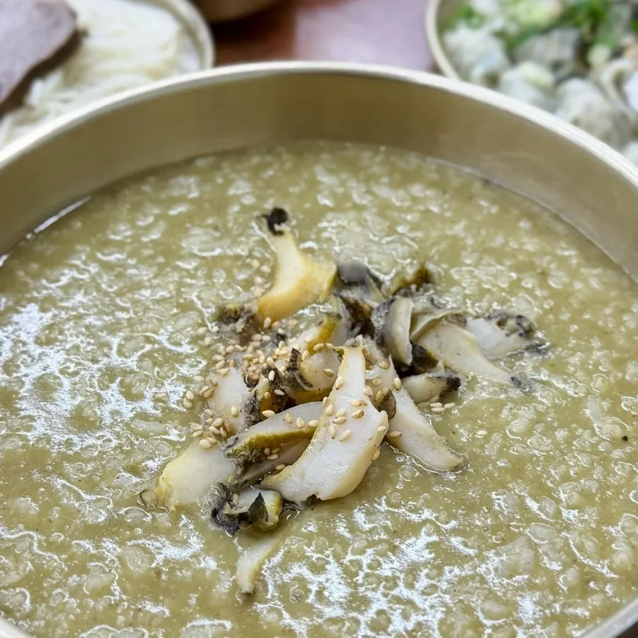 A spoonful of the rich, sticky abalone porridge
