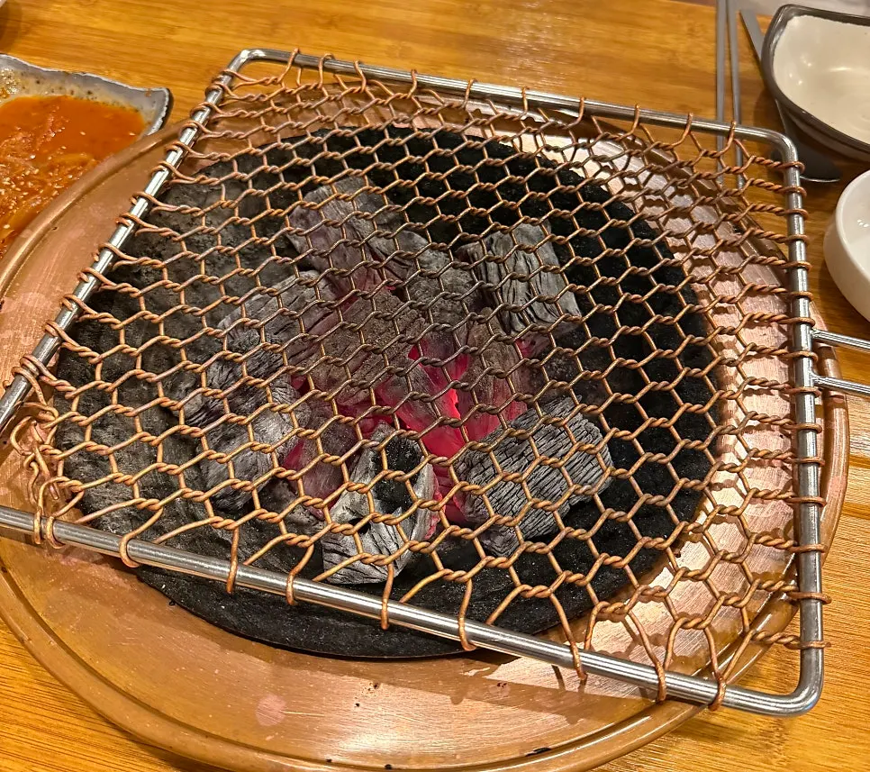 Charcoal brazier brought to the table
