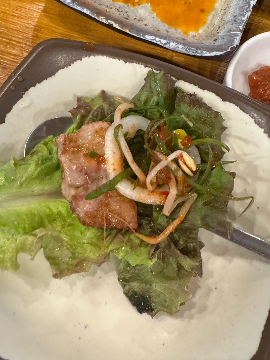 Fresh raw ribs wrapped in aged kimchi